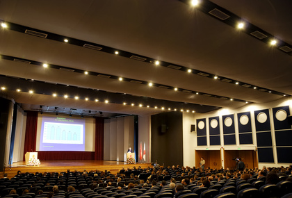 convention venue with stage looming bright