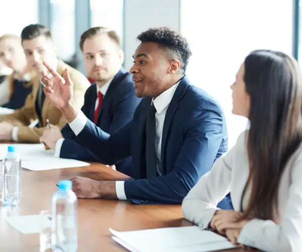 International colleagues listening in a meeting
